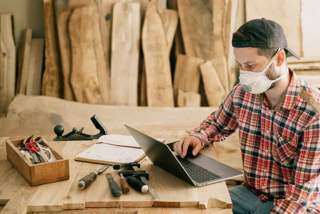 Woodworking-By-LPI-Woodworking-Sitting-at-table-with-laptop