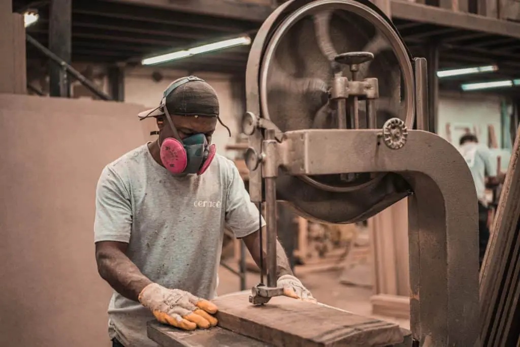 Woodworking By LPI - Woodworker Cutting With Gloves